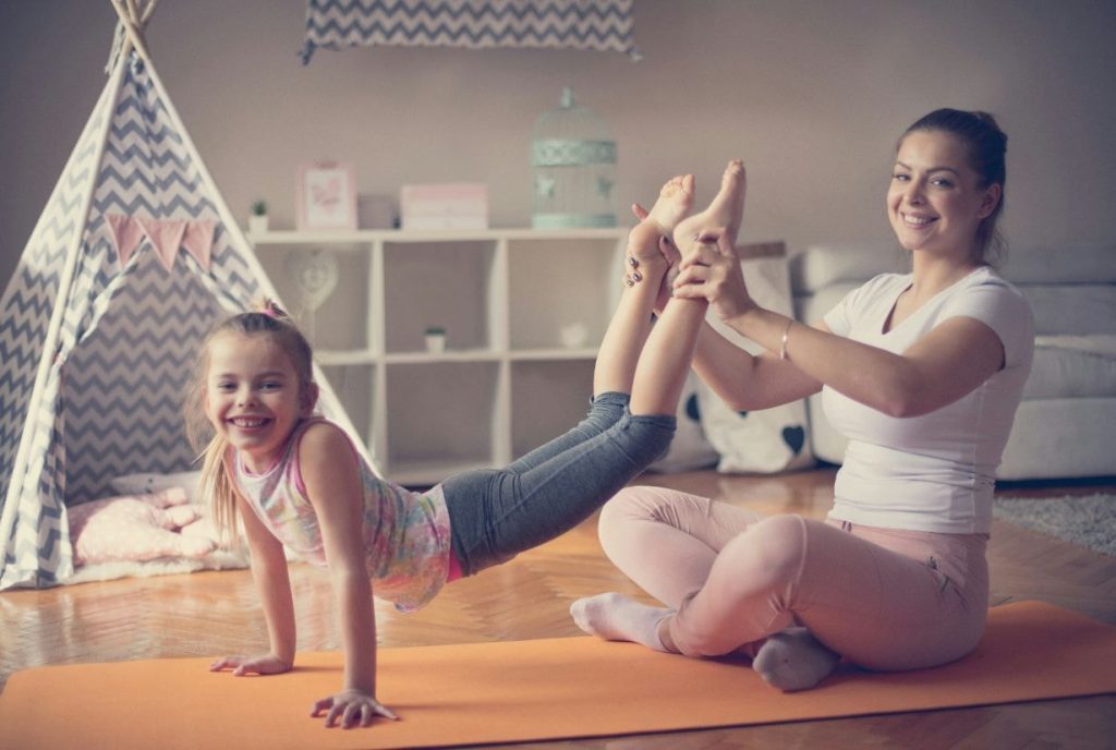 Physiotherapist helping the child to exercise