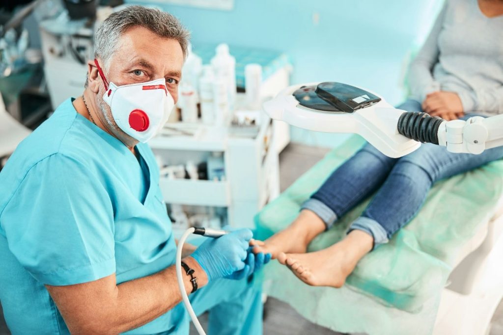 Podiatrist removing hard skin