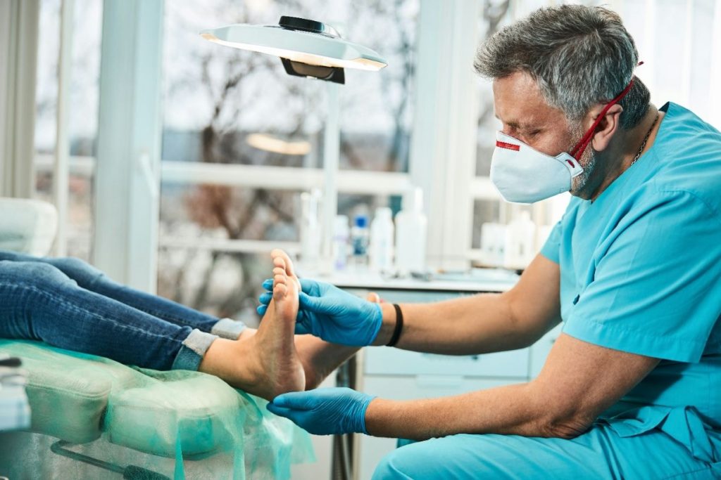 Podiatrist treating nail